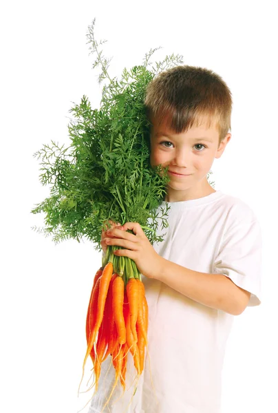 Niño con zanahorias —  Fotos de Stock