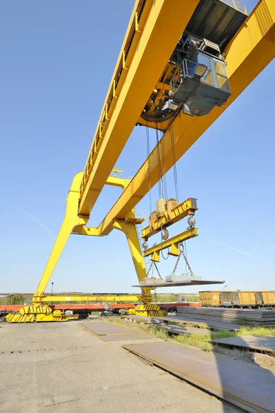 Crane and steel plates — Stock Photo, Image