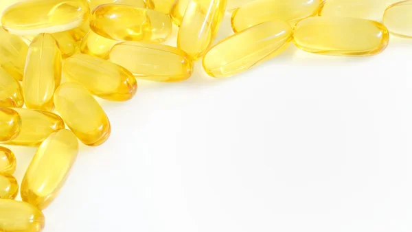 Yellow fish oil capsule — Stock Photo, Image