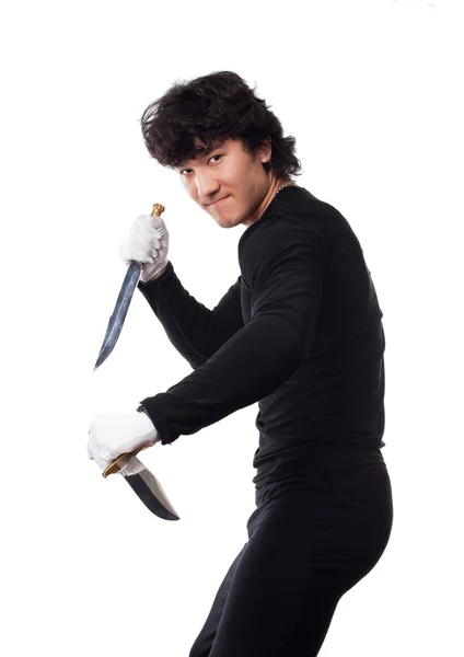 Asiático hombre con cuchillo en un blanco —  Fotos de Stock