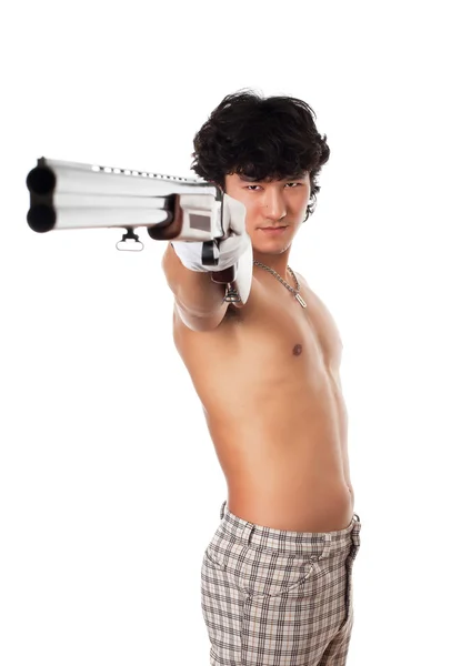 Asian man with nude torse holding gun — Stock Photo, Image