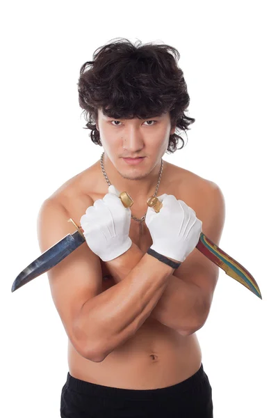 Азиатский мужчина с двумя ножами — стоковое фото