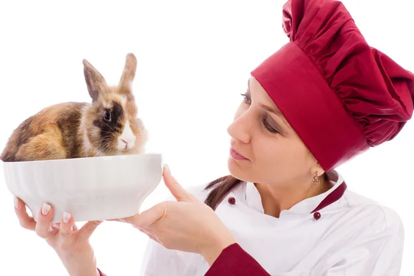 Шеф-кухар з карликовим кроликом всередині миски — стокове фото