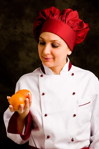 Chef is controlling orange quality — Stock Photo, Image