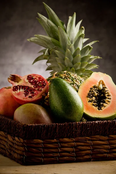 Basket with tropical fruits — Stock Photo, Image