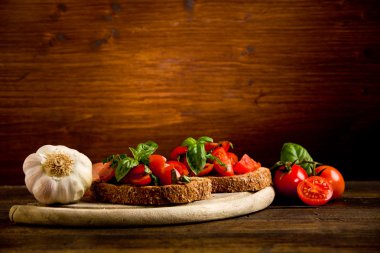 Bruschetta appetizer with fresh tomatoes clipart