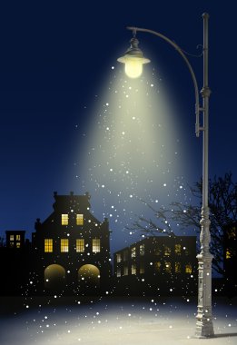 Snow falls in the city at night clipart