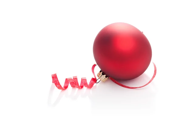 Curly ribbon and Christmas Bauble — Stock Photo, Image