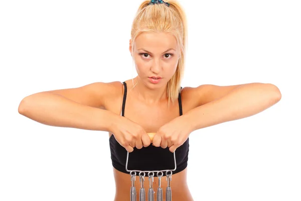 Woman doing fitness with an expander — Stock Photo, Image
