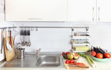 Kitchen interior with fresh vegetables clipart