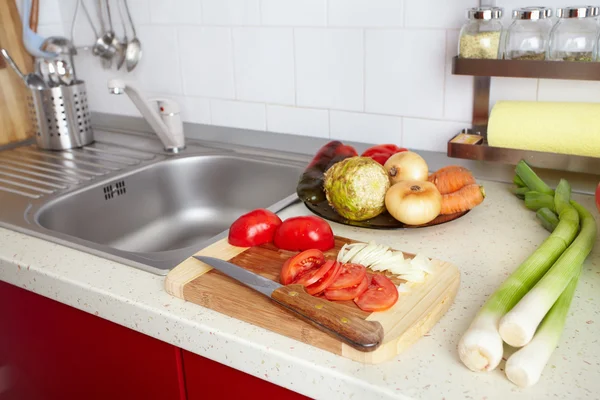 Kitchen interior with fresh vegetables — Stock Photo, Image
