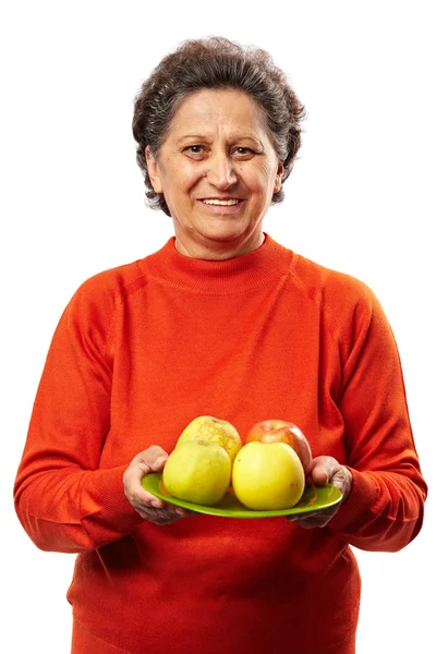 Mujer mayor con manzanas — Foto de Stock