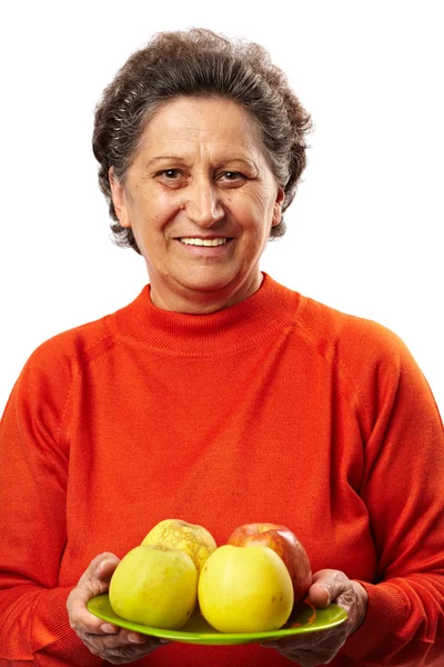 Starší žena s jablky — Stock fotografie