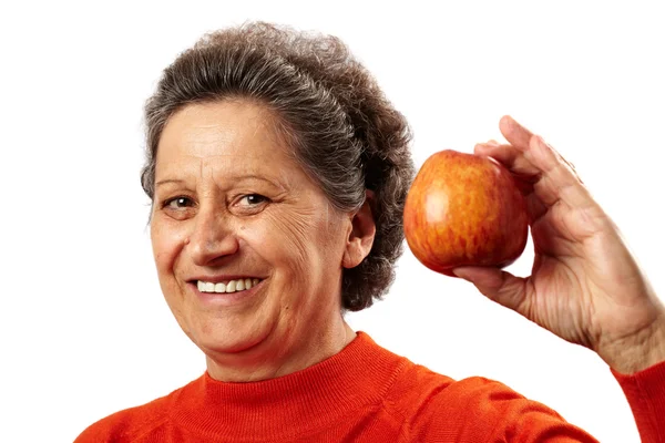 Senior woman with apple — Stock Photo, Image