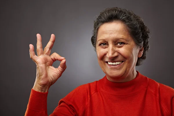Happy senior woman making ok sign — Stock Photo, Image