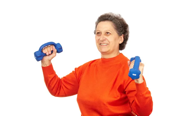 Signora anziana attiva che fa fitness Foto Stock
