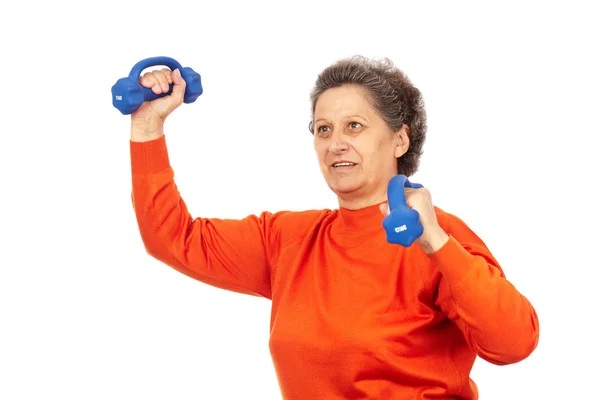 Aktivní starší paní, co dělá fitness Stock Snímky