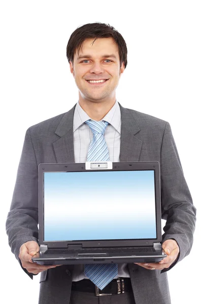 Młody biznesmen posiadania laptopa — Zdjęcie stockowe