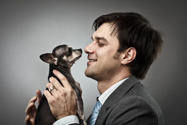 Affärsman med hans husdjur — Stockfoto
