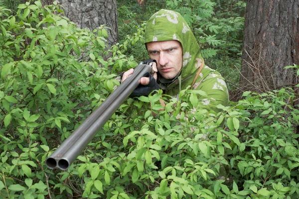 Angry hunter with an old gun — Stock Photo, Image