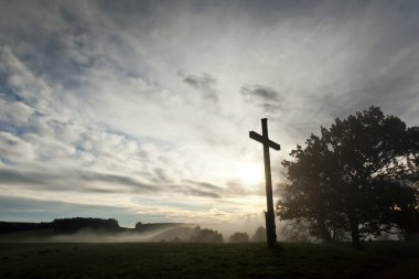 Dramatic sky and a cross clipart