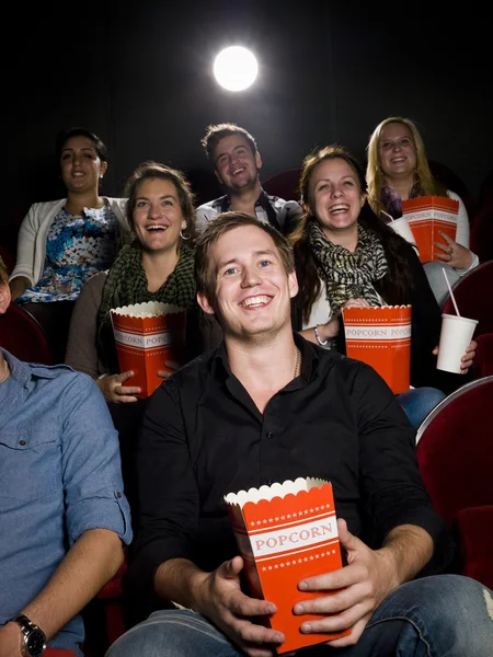 Man at the cinema with popcorn — Stock Photo, Image
