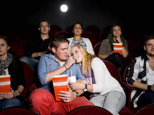 Young couple at cinema Stock Picture