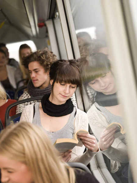 Reading at the bus — Stock Photo, Image