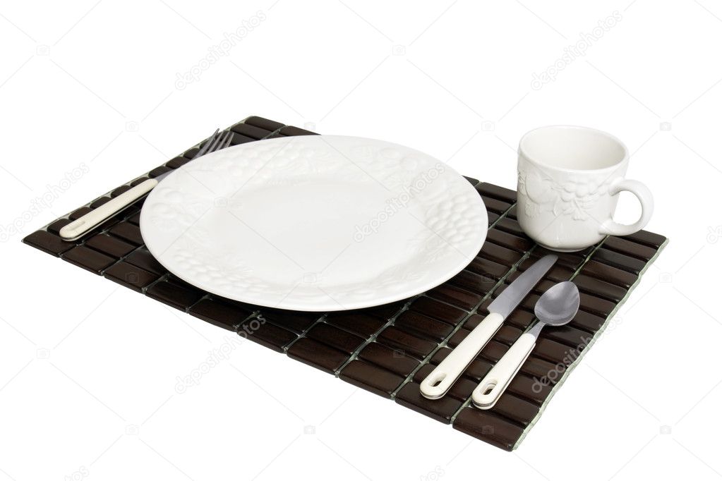 Wooden place mat with white dinner plate setting