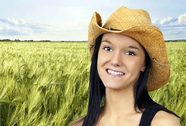 Pretty cowgirl making peace sign Royalty Free Stock Photos