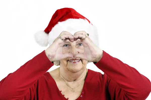 Grandma making heart symbol — Stock Photo, Image