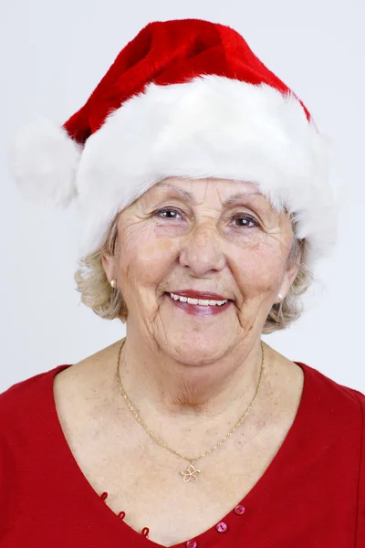 垂直的奶奶戴着圣诞帽子 — 图库照片