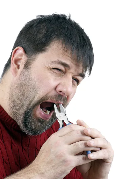 Man pulling his own tooth — Stock Photo, Image