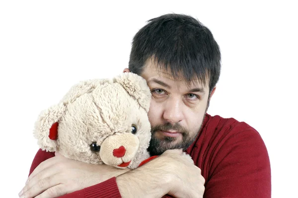 Guy abraçando ursinho de pelúcia — Fotografia de Stock