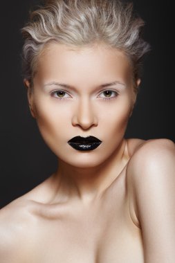 Woman model with fashion make-up, gloos black lips, white eyeshadows clipart