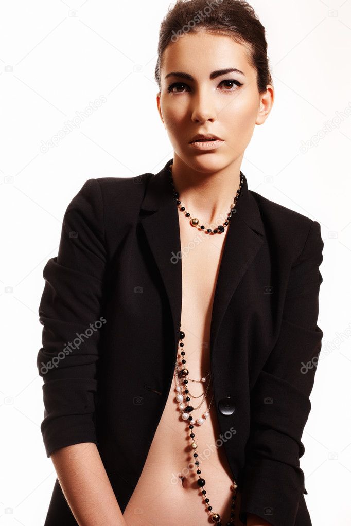 Fashion sexy woman in business costume, with long beads and back hairstyle