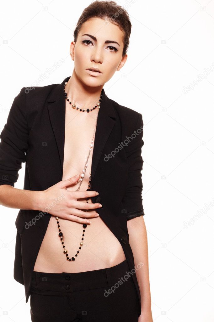 Fashion sexy woman in business costume, with long beads and back hairstyle