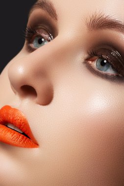 Fashion model face with bright glamour makeup. Perfect skin, wet gloss eyes clipart