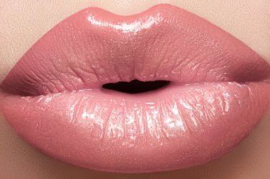 Gentle kiss. Beautiful fashion lip make-up. Macro of female lips