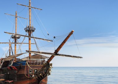 Old fashioned ship in sea clipart