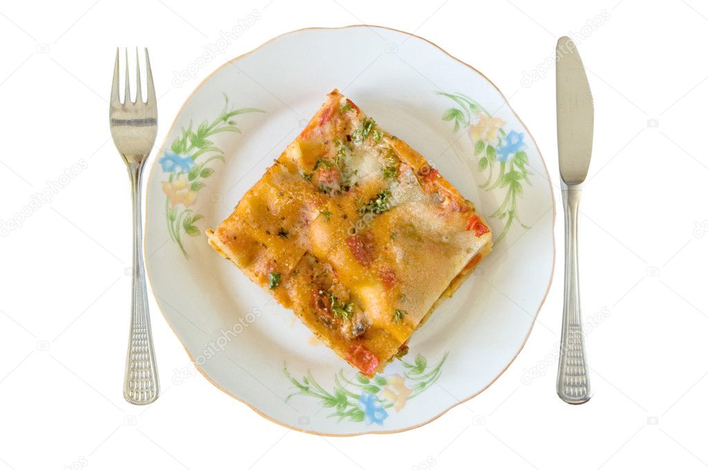 Lasagna slice in a plate isolated