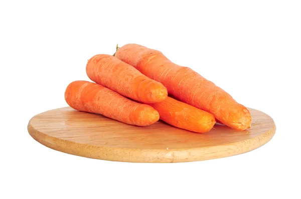 Fresh carrots on wooden board — Stock Photo, Image