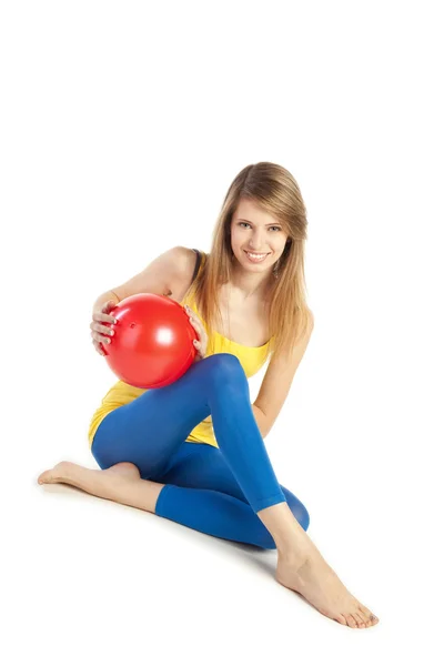 Chica deportiva con bola roja —  Fotos de Stock