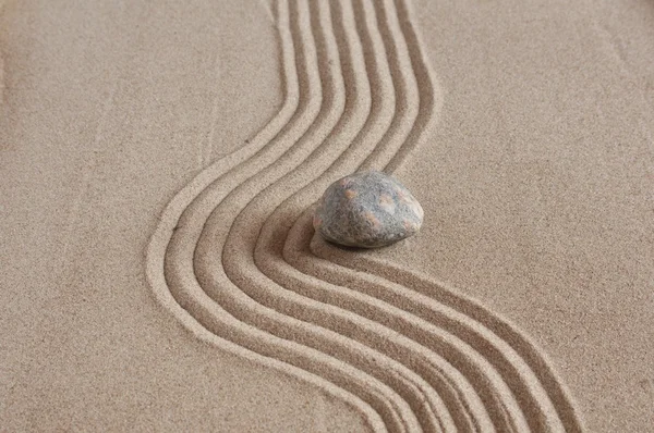 Stone in sand — Stock Photo, Image