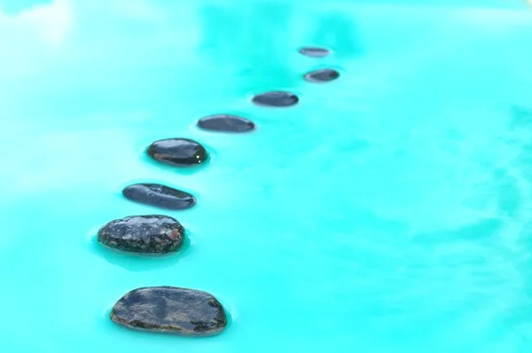 Eight stones in water — Stock Photo, Image