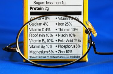 Focus on the nutrition facts from a box of food concepts of eat healthy clipart