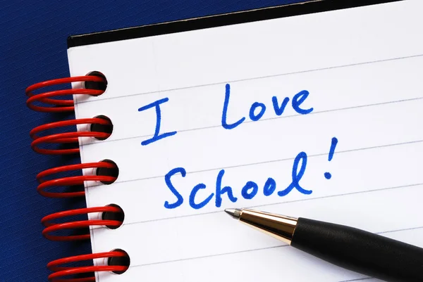 Escribir las palabras Me encanta la escuela en el concepto de cuaderno de la educación —  Fotos de Stock