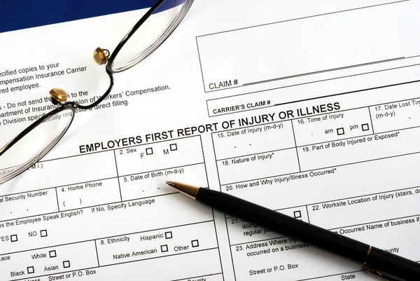 Fill in the workmen compensation injury claim form — Stock Photo, Image