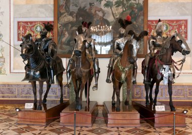 The exhibition in the Hermitage Museum, four horsemen in armor. clipart