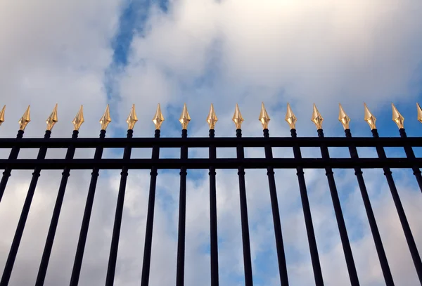 stock image Steel fence with gold spears